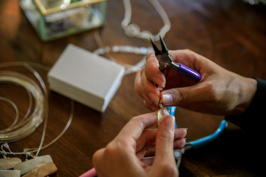 pexels photo 10474291 10474291 Detailed view showcasing the art of jewelry making with pliers and delicate hands.